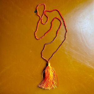 Beaded necklace with tassel detail at bottom.  19’’ beaded chain length.